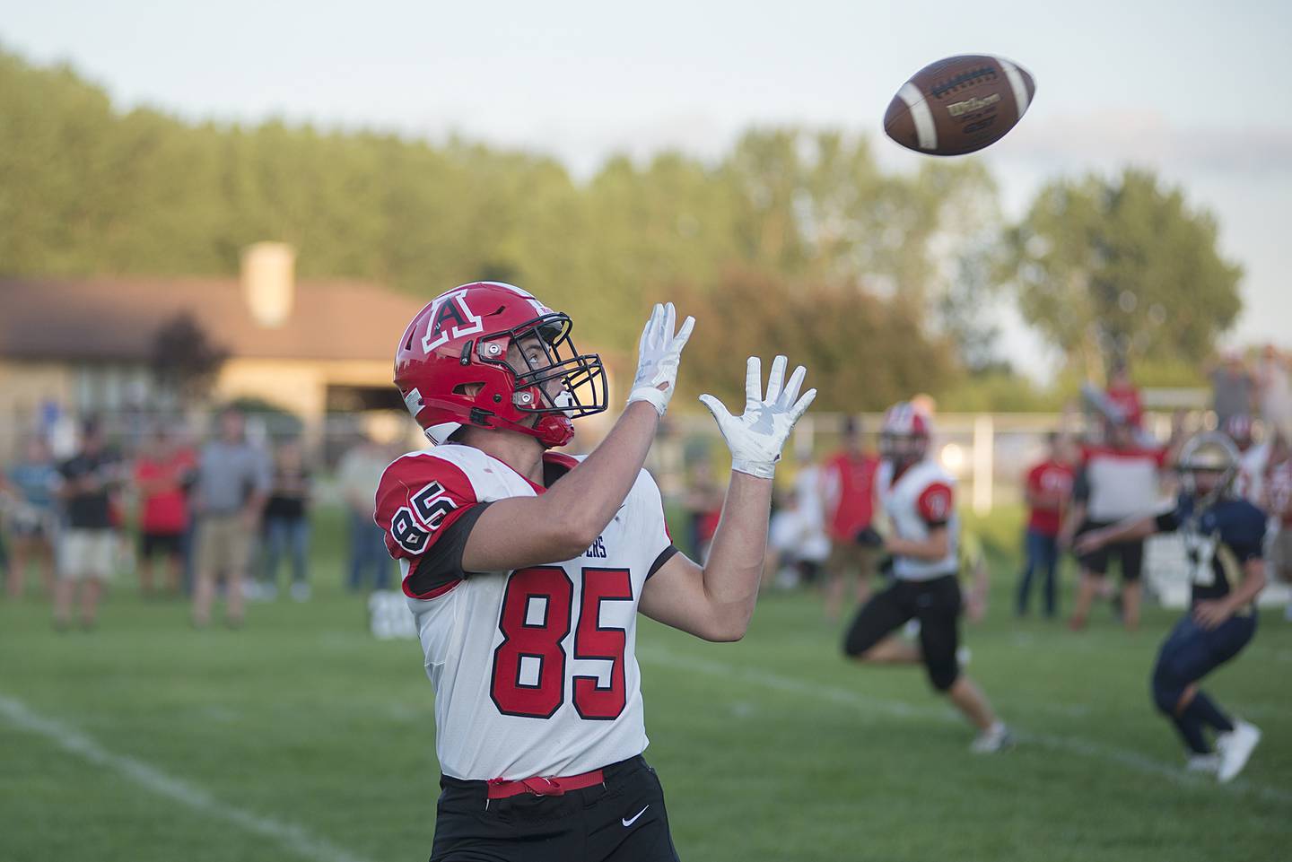 Amboy’s Brennan Blaine hauls in a catch Friday, Aug. 26, 2022 for his first touchdown of the game against Polo.
