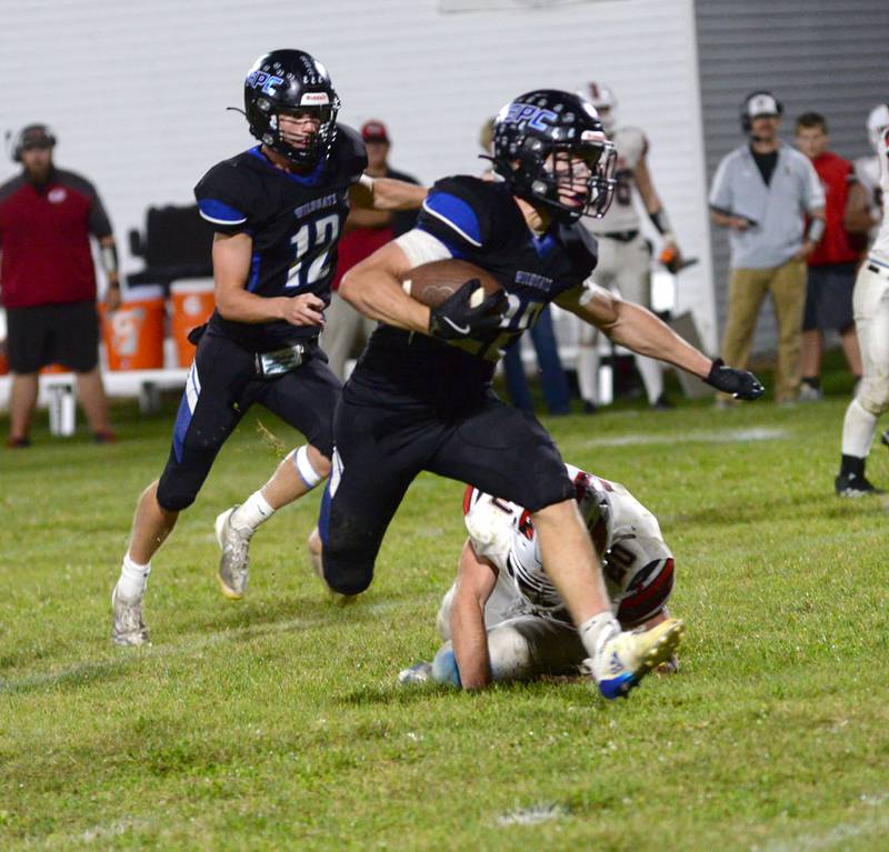 Eastland-Pearl City's Draven Zier (22) runs for a gain against Forreston on Friday, Sept. 20, 2024 in NUIC Conference action in Pearl City.
