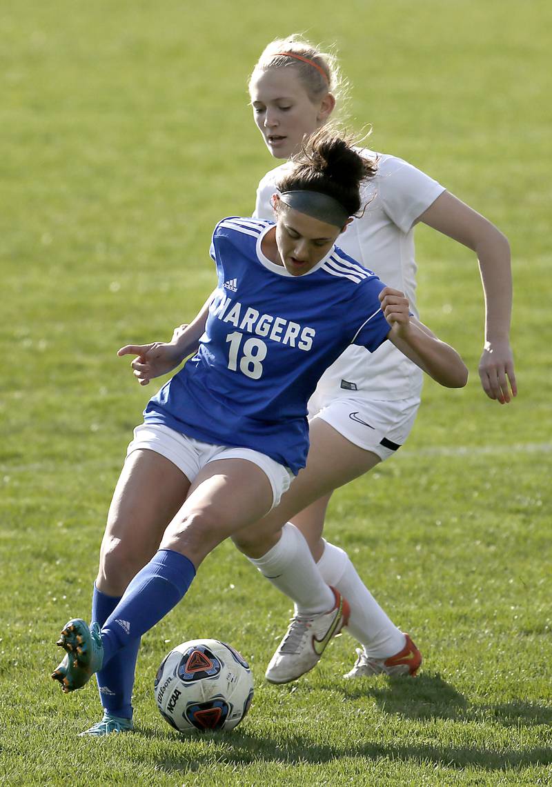 Dundee-Crown's Berkley Mensik reverses directions in front of Crystal Lake Central's Maddie Gray, during a Fox Valley Conference soccer match Tuesday April 26, 2022, between Crystal Lake Central and Dundee-Crown at Dundee-Crown High School.