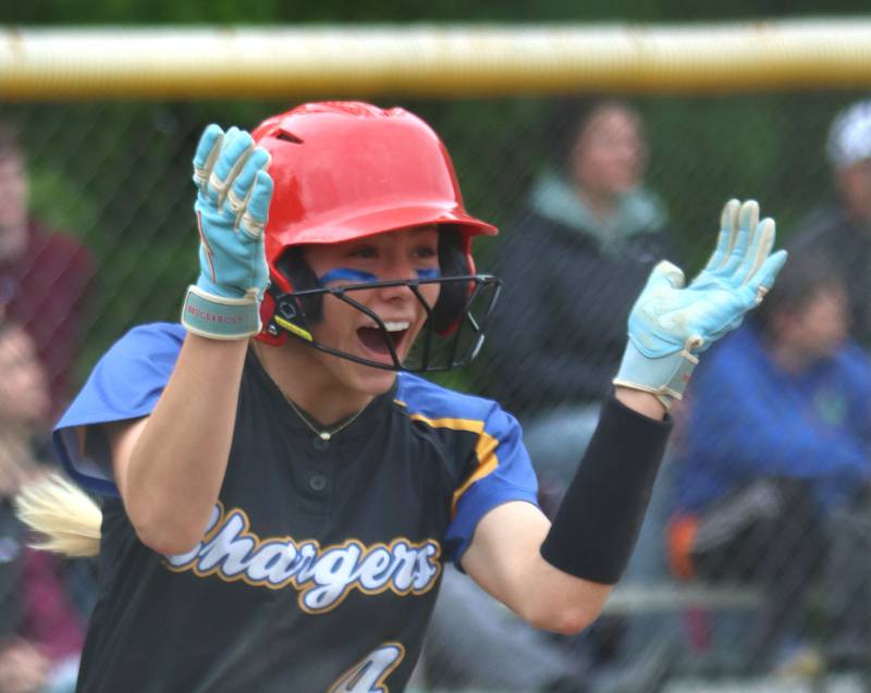 Aurora Central Catholic’s Grace Grunloh celebrates arriving safely at home to score the game winning run against Marengo in varsity girls softball IHSA Class 2A Regional Title Game action on Friday, May 22, 2026 at Raymond Benoy Field on the campus of Marian Central High School in Woodstock.