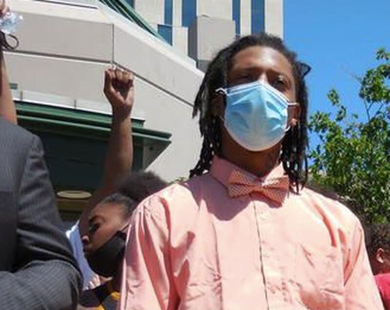 Jamal Smith (center) at a press conference outside Joliet City Hall in 2020.