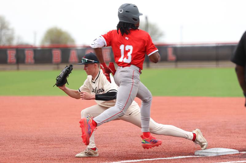 Bradley-Bourbonnais' Aiden Fitzgerald catches the out at first base during the Boilermakers' 8-7 loss to Homewood-Flossmoor on Monday, April 13, 2026.