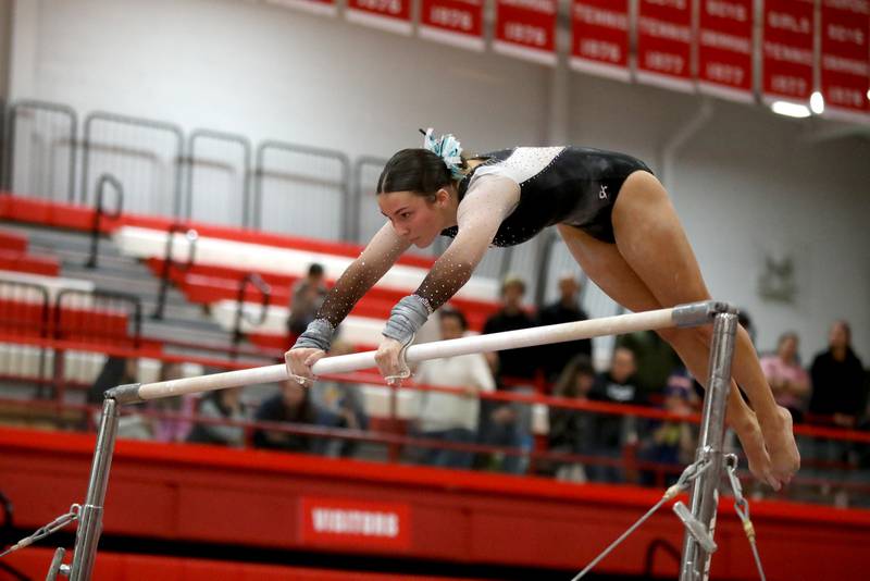 Lincoln-Way East’s Alaina Lekki competes on the uneven bars during the Hinsdale Central Sectional on Monday, Feb. 10, 2025 in Hinsdale.