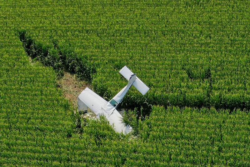 A plane rests in a corn field after crashing near the DeKalb Taylor Municipal Airport in Cortland on Thursday, July 27, 2023.