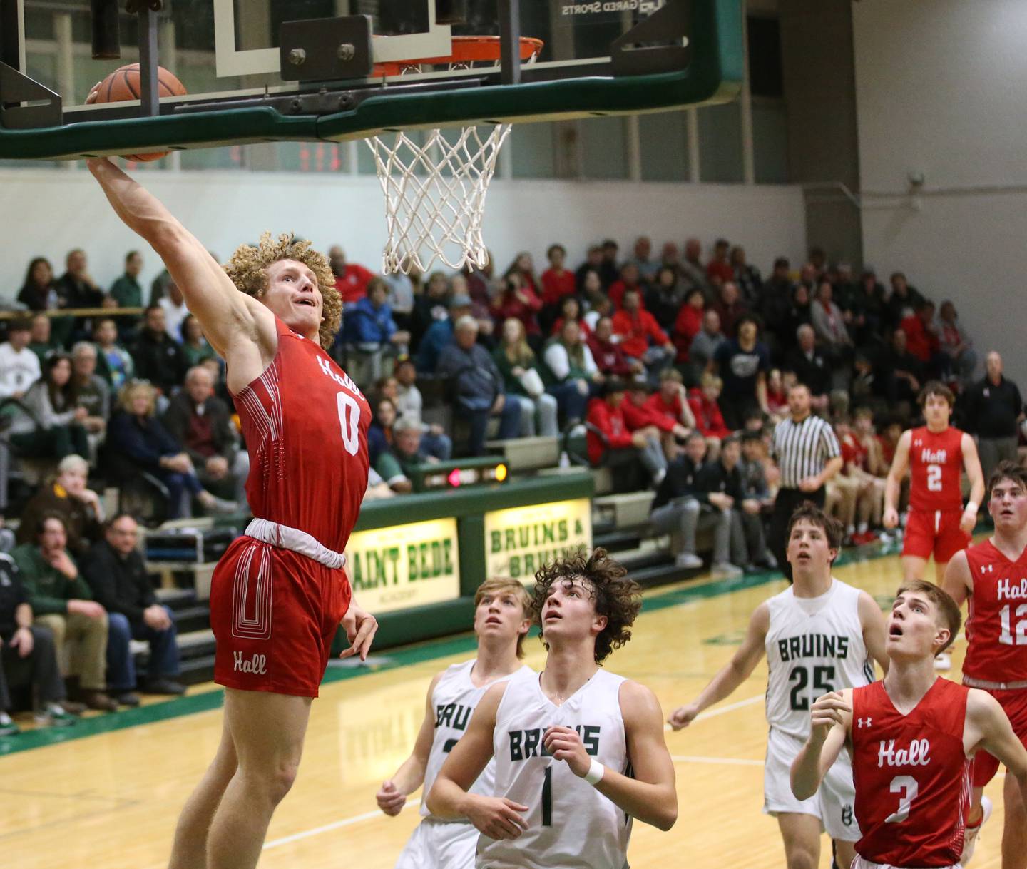 Hall's Mac Resetich (left) dunks the ball over St. Bede in the second quarter on Monday, Dec. 14, 2022 at St. Bede Academy.