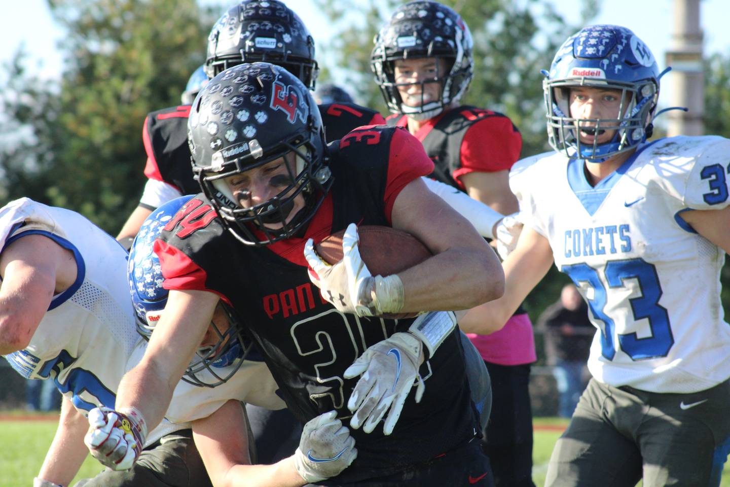 Erie-Prophetstown running back Connor Sibley (34) fights for extra yardage. He had 11 carries for 93 yards and scored on a 17-yard touchdown run on Saturday, Oct. 30, 2021, in a Class 2A playoff game at Erie High School.