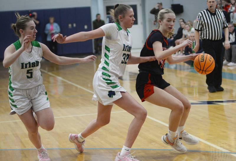 Stillman Valley's Taylor Davidson (15) draws the attention of two Peoria Notre Dame defenders at the 2A Super-Sectional on Monday, March 3, 2025 at Bureau Valley High School in Manlius.