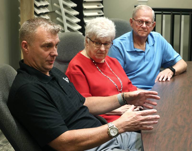 Greg Spears, (left) Ken Spears Construction president, talks about his company with his parents and company founders, Ken and Kathy Spears looking on Friday, Aug 22, 2025, at the business in DeKalb. The company is celebrating its 50th anniversary this year.