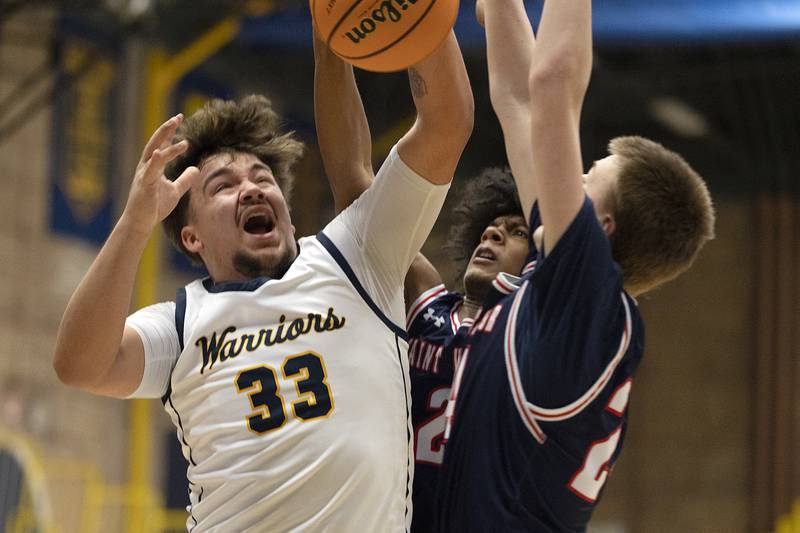 Sterling’s Maddux Osborn goes up for a shot against St. Viator’s Landon Ray Monday, Jan. 20, 2025, during Sterling’s MLK Classic.