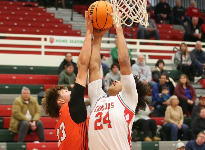 Pontiact's Caden Mashing and L-P's Marion Persich battle for a rebound on Tuesday, Dec. 17, 2024 in Sellett Gymnasium at L-P High School.