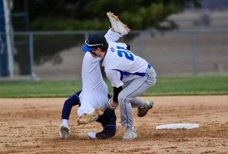 Bureau Valley's Sam Rouse takes a tumble on a stole base attempt Wednesday against Newman. The Comets won 4-0.
