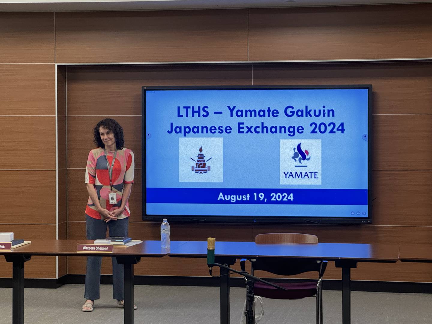Japanese teacher Karla Button gives a presentation to the board of education about the school's exchange trip to Japan in August 2024.