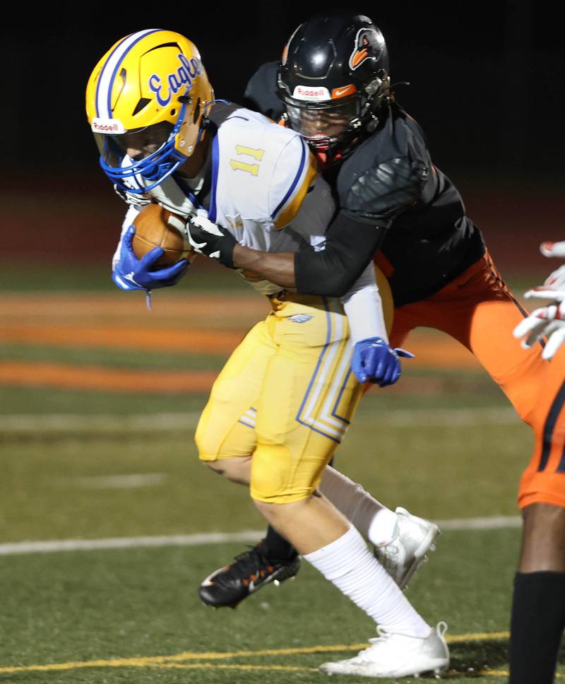 DeKalb’s Rahsheed Greer brings down a ball carrier during their game against Sandburg Friday, Sept. 8, 2023, at DeKalb High School.
