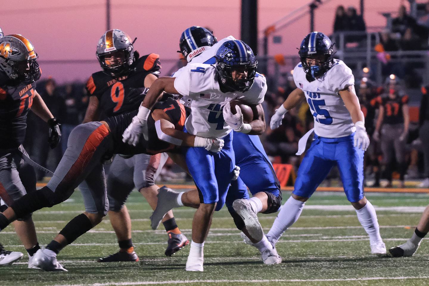 Lincoln-Way East's Trey Johnson breaks through the line against Minooka in the Class 8A 2nd round playoffs in Minooka on Saturday, Nov. 6, 2021.
