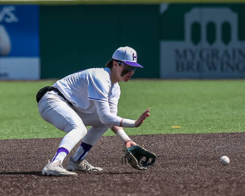 Hampshire's Dominic Borecky (10) looks in a grounder to short during baseball game between Dixon at Hampshire.  March 28, 2024