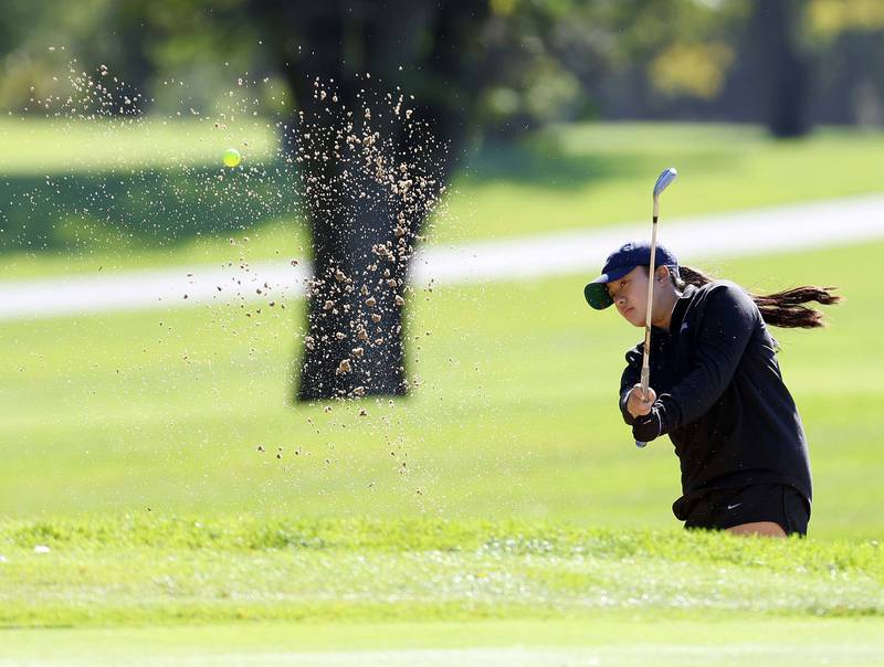 Angel Nguyen of Glenbard North, comes out of a sand trap during the IHSA Class 2A West Chicago girls golf regional at St. Andrews Tuesday, Oct. 1, 2024 in West Chicago.