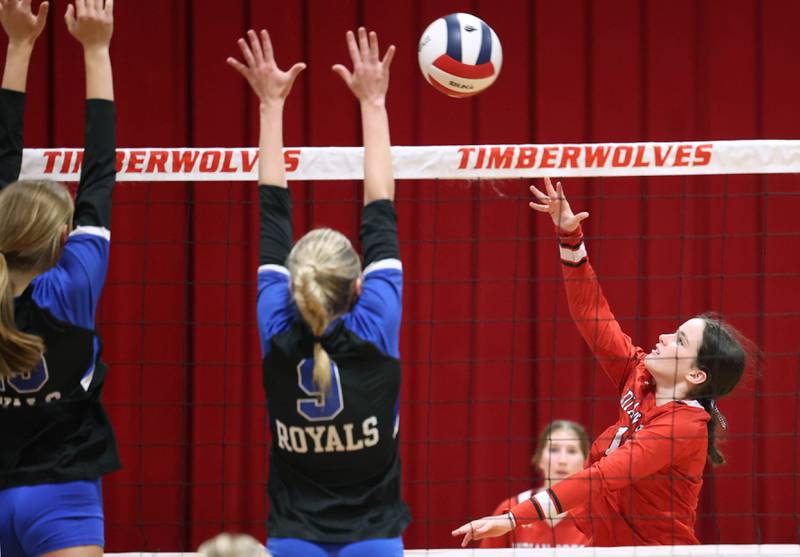 Indian Creek's Abby Keilman tries to tip the ball over a pair of Hinckley-Big Rock blockers during their match Tuesday, Sept. 9, 2025, at Indian Creek High School in Shabbona.
