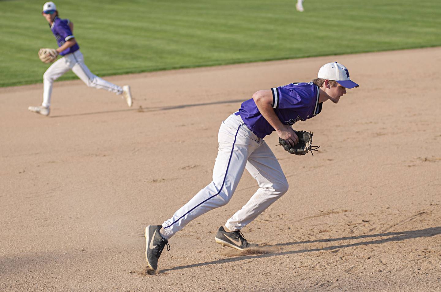 Dixon’s Jacob Gaither fields a grounder against North Boone Thursday, May 12, 2022.