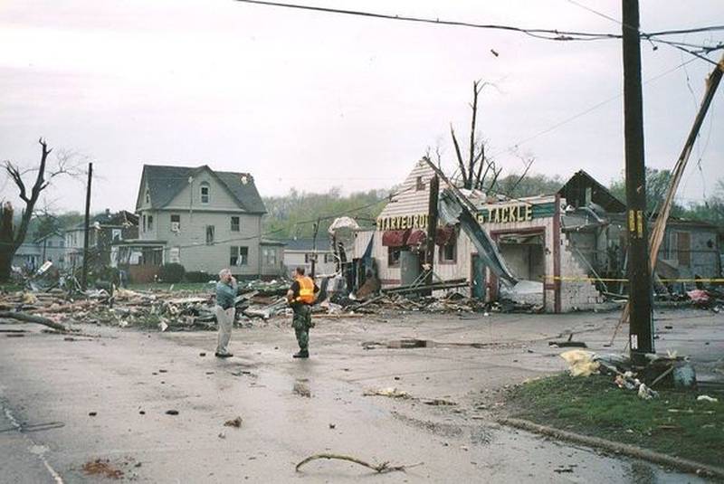 La Salle County Sheriff Tom Templeton (left) observes the tornado damage at Starved Rock Bait and Tackle on Tuesday, April 20, 2004 in Utica.