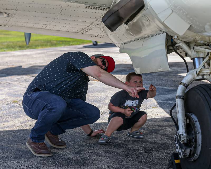 Jim Morgan points something out to his son Richie at the Brookeridge Airport Fly in.  Sept 10, 2022.