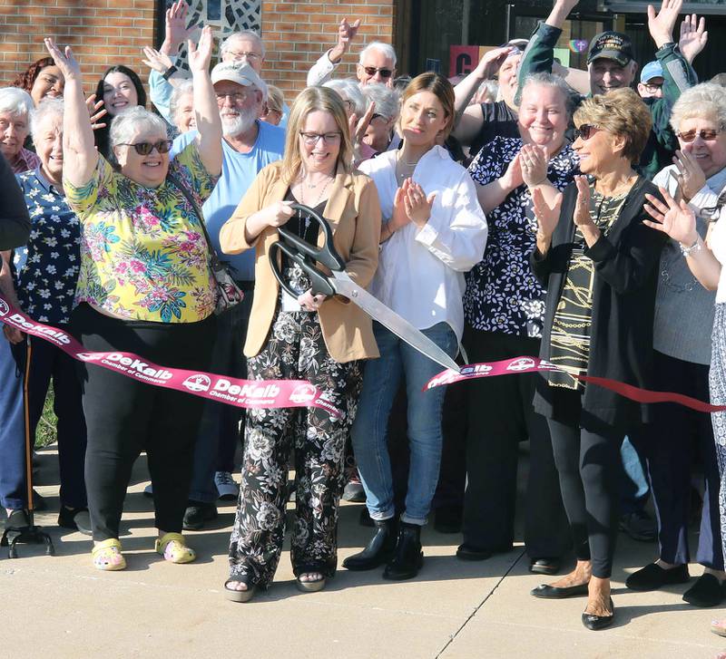 Tynisha Clegg, executive director of Family Service Agency, along with representatives from the city as well as staff and patrons of Club 55 cut the ribbon Monday, April 10, 2023, at the new location of Family Service Agency’s Club 55 in DeKalb. The senior center is celebrating its grand reopening in its new location at Bethlehem Lutheran Church, 1915 North First Street, in DeKalb.