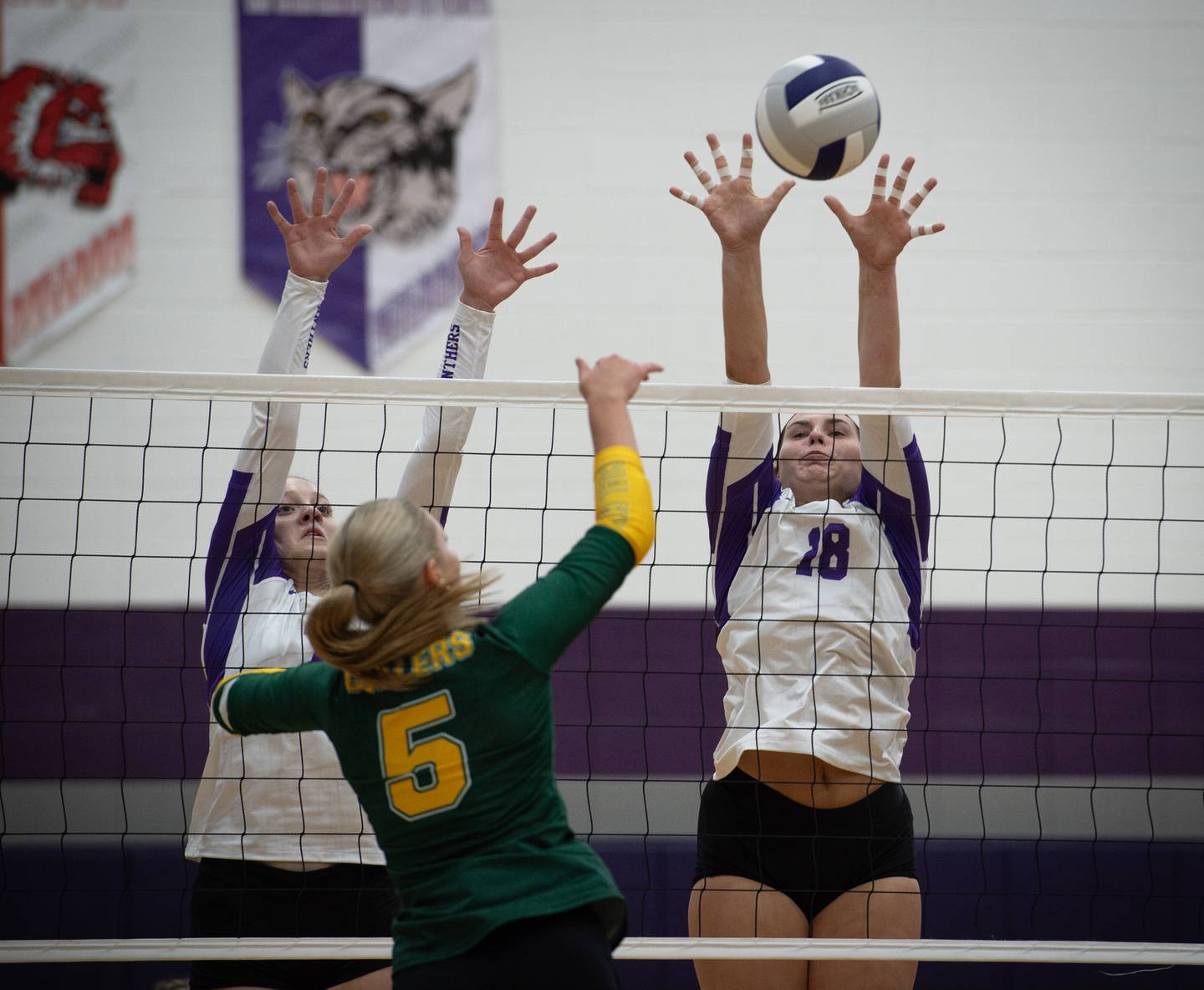 Manteno's Leah Milton, left, and Maddie Gesky, right, defend against a hit from Coal City's Averie Hodgen in a match on Thursday, September 11, 2025.