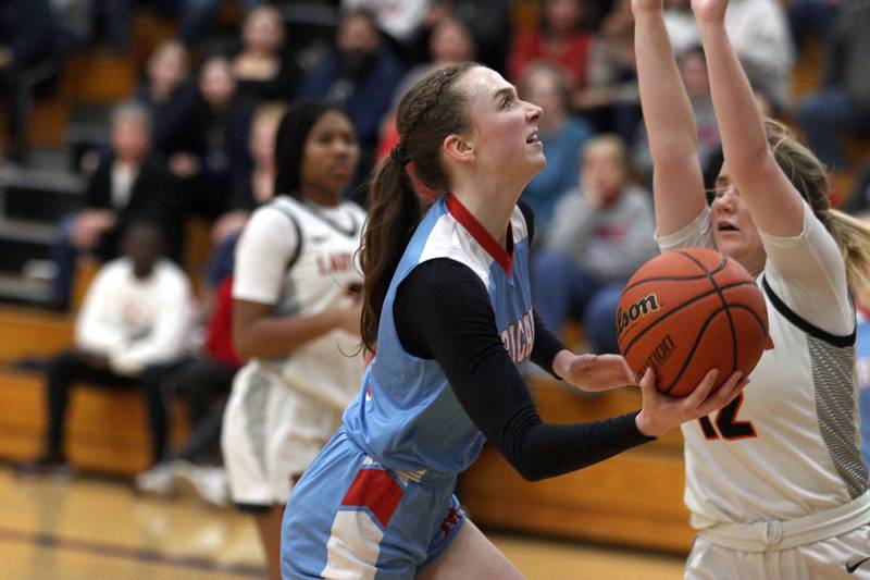 Marian Central’s Juliette Huff works under the hoop against Byron in Class 2A Regional Championship action at Rockford Christian Friday.