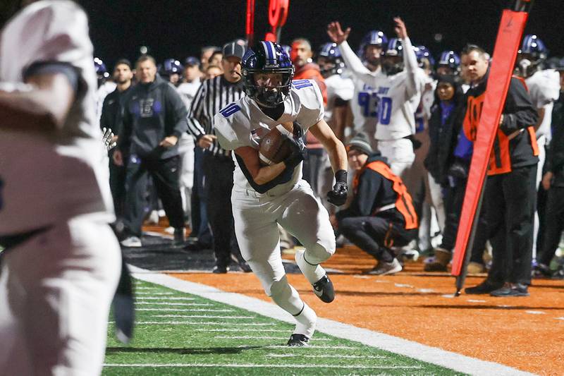 Lincoln-Way East’s MJ Schley takes a catch up the sidelines against Minooka on Friday, Nov. 8, 2024 in Minooka.