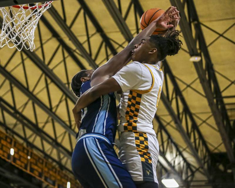 Joliet West's Aamir Shannon (0) is fouled under the basket by Plainfield South's Khalil Truman (10) during their basketball game between Plainfield South at Joliet West, Feb 2, 2026 in Joliet.