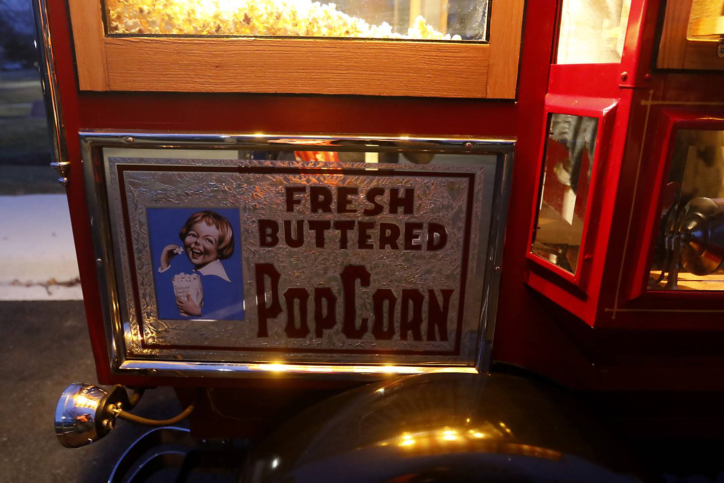 A sign on the side of Scott Uglinica’s 1928 Ford Model Popcorn Wagon on Wednesday, Jan. 18, 2023, at Veterans Memorial Park in McHenry.