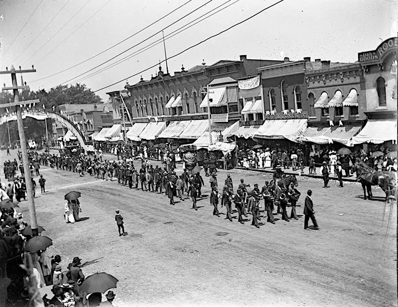 Members of the Modern Woodmen of America fraternal benefit society march in a parade in Sycamore in 1894.