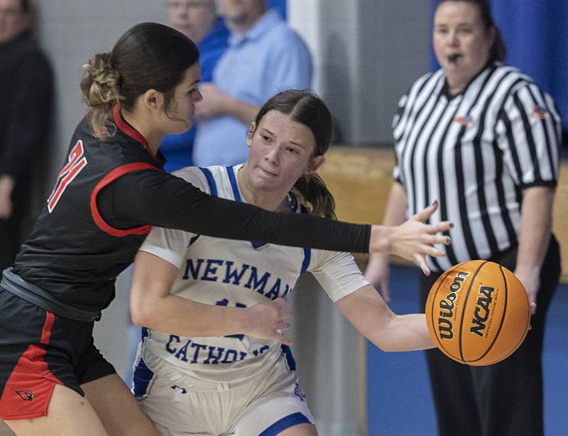 Newman’s Lucy Oetting makes a pass while being guarded by Stillman Valley’s Emma Withers Monday, Feb. 2, 2026.