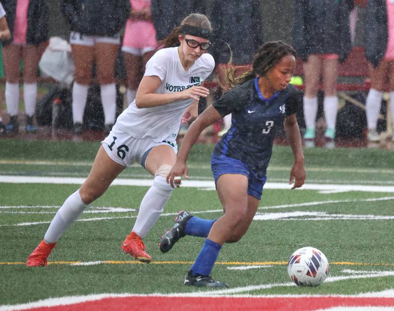 Burlington Central's Mekenzie Rogers tries to pull away from Peoria Notre Dame's Abigail Shaddock during their third place game Saturday, June 1, 2024, at the IHSA Class 2A state soccer finals at North Central College in Naperville.
