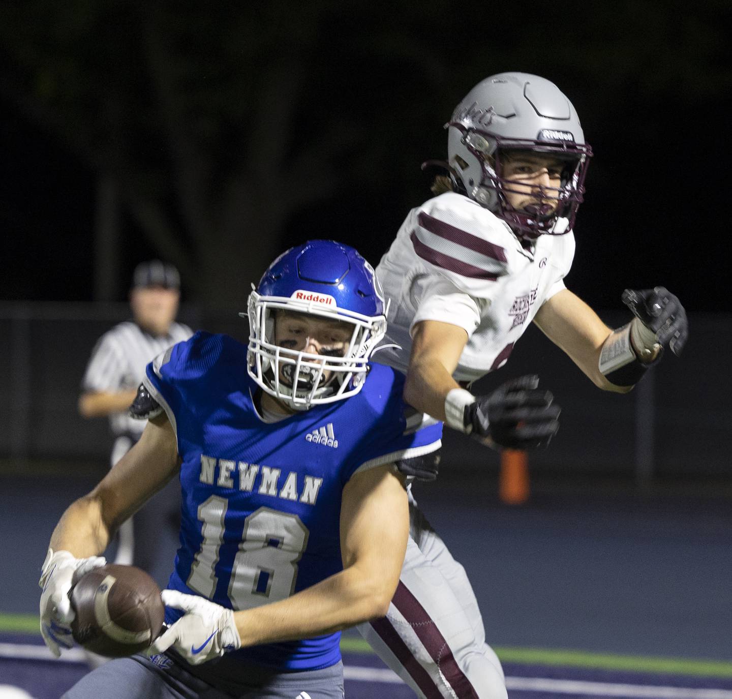 Newman’s Matthew Blackert intercepts a pass to secure the win for the Comets in front of Rockridge’s Baylen Leemans Friday, Sept. 27, 2024, in Sterling.