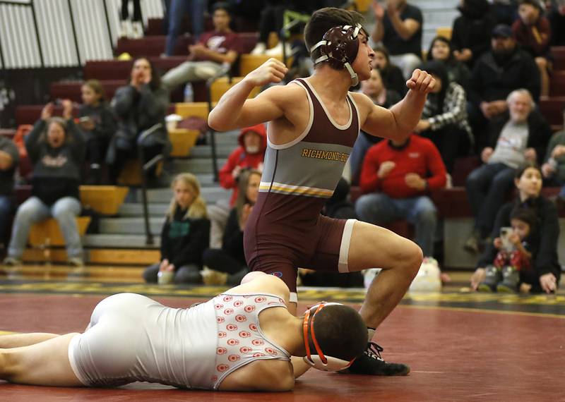 Richmond-Burton’s Emmett Nelsen celebrates defeating Marian Central’s Kaden Harman in the 126-pound championship wrestling match in the IHSA 1A Richmond-Burton Wrestling Regional Thursday, Jan. 19, 2023, at Richmond-Burton High School in Richmond.