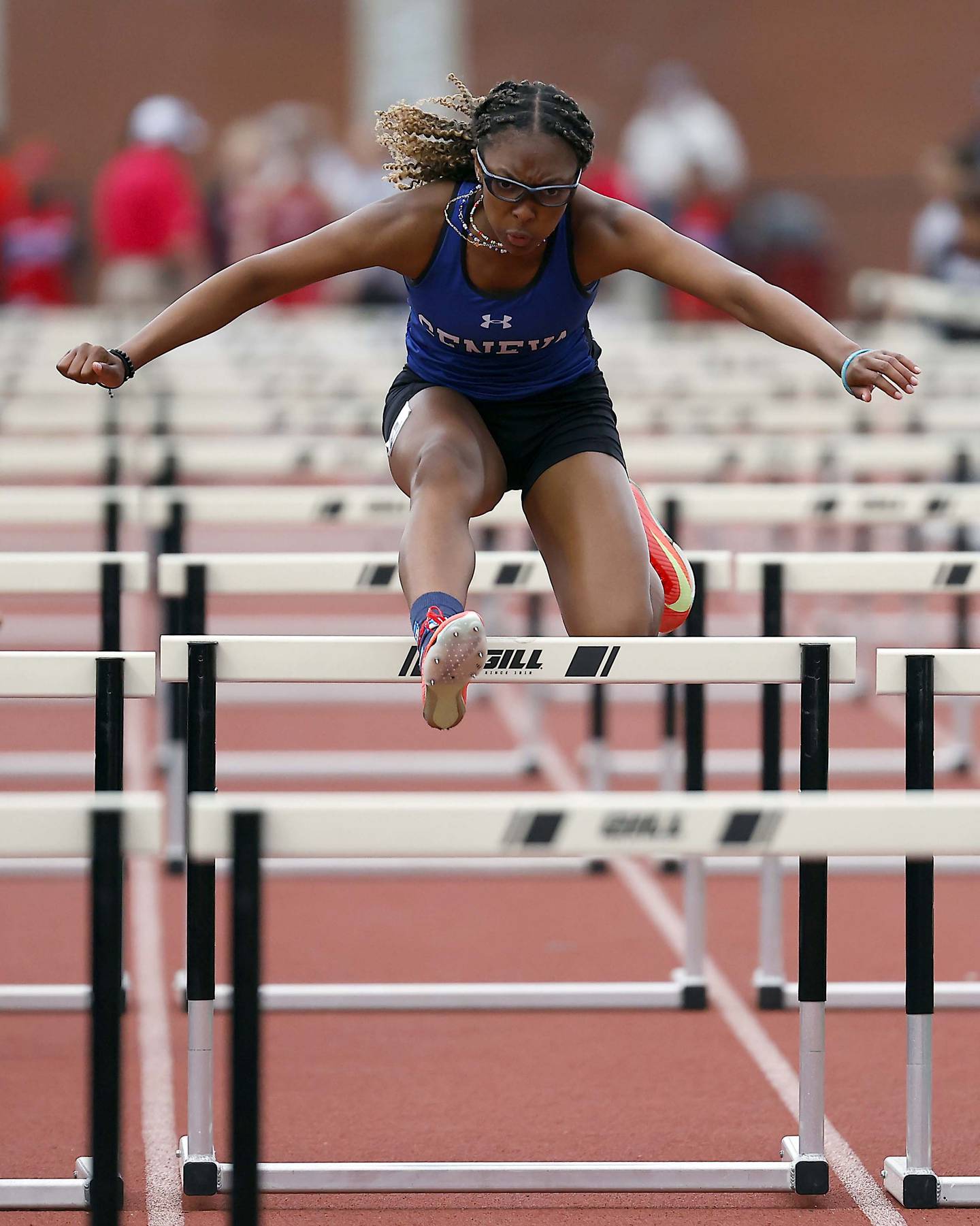Alyssa Flotte of Geneva competes in the 100m Hurdles during the Kane County girls track and field meet at East Aurora High School Friday, May 2, 2025 in Aurora Ill.