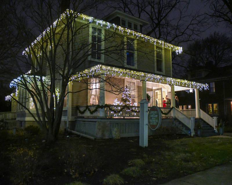 Community members enter The Samuel Vial House that is now the La Grange Historical society and museum on La Grange road during the Holiday Sip and Sweet Tour event held on Sunday Dec. 17, 2023.