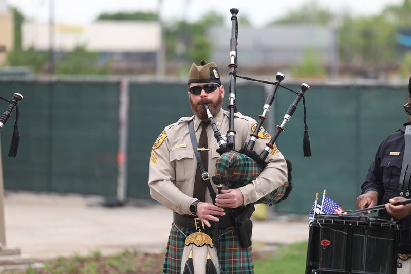 A Will County Sheriff’s Police officer plays the the pipes during the Will County Law Enforcement Memorial ceremony on Thursday, May 9, 2024 in downtown Joliet.