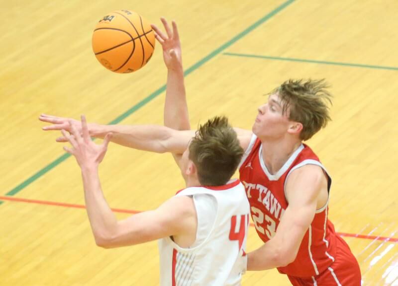 Ottawa's Owen Sanders knocks the ball away from Streator's Blaize Bressner during the Class 3A Regional semifinal game on Wednesday, Feb. 26, 2025 in Sellett Gymnasium at L-P High School.