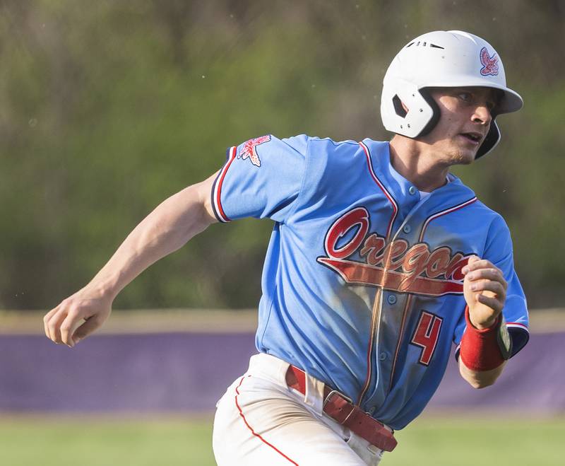 Oregon’s Avery Lewis rounds third to score against Dixon Thursday, April 24, 2025.