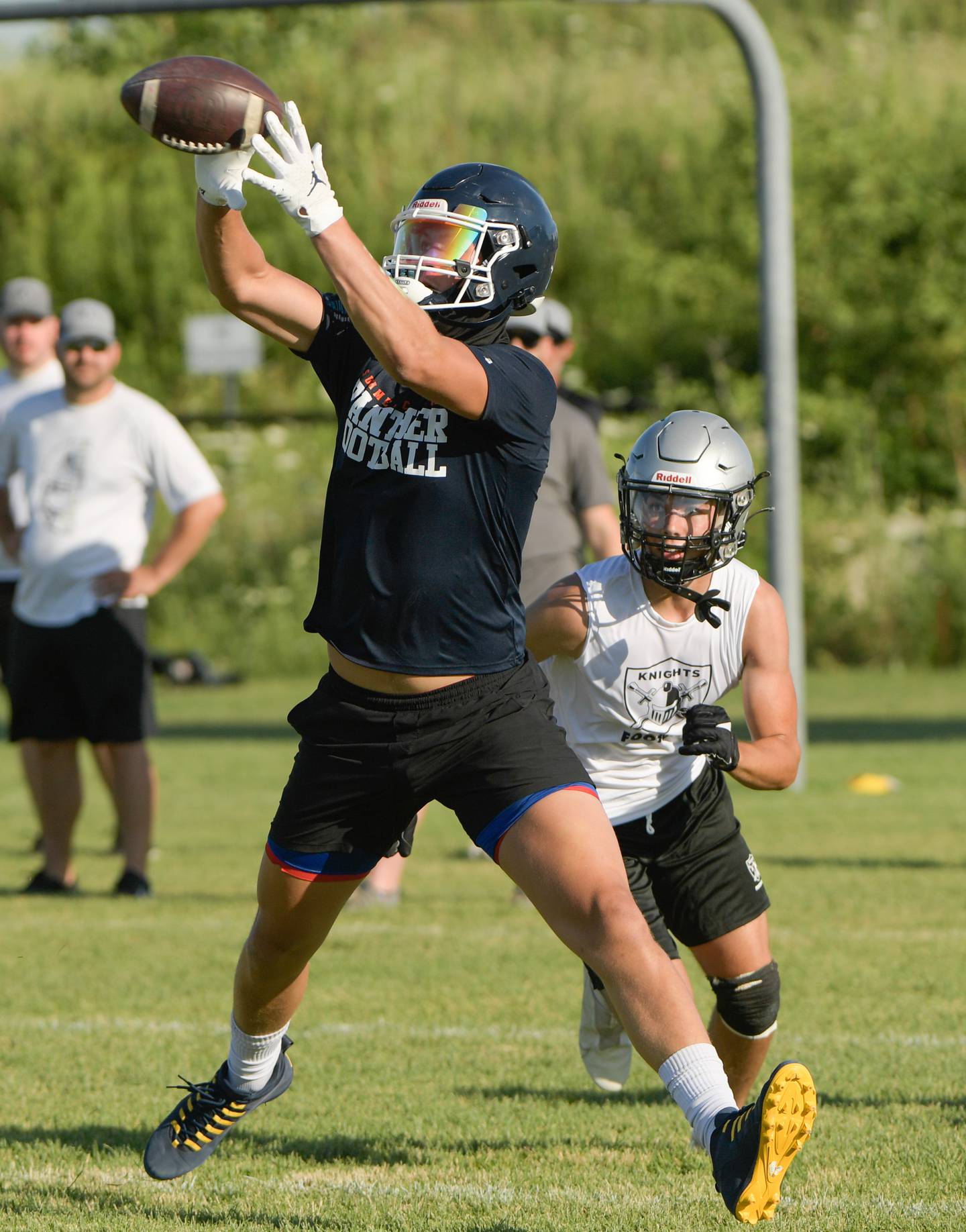 Oswego’s Deakon Tonielli catches a pass during a 7 on 7 football against Kaneland in Maple Park on Tuesday, July 12, 2022.