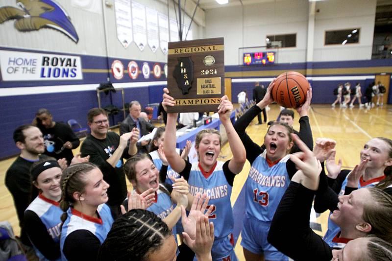 Marian Central’s Hurricanes celebrate a 2-OT win over Byron in Class 2A Regional Championship action at Rockford Christian Friday.