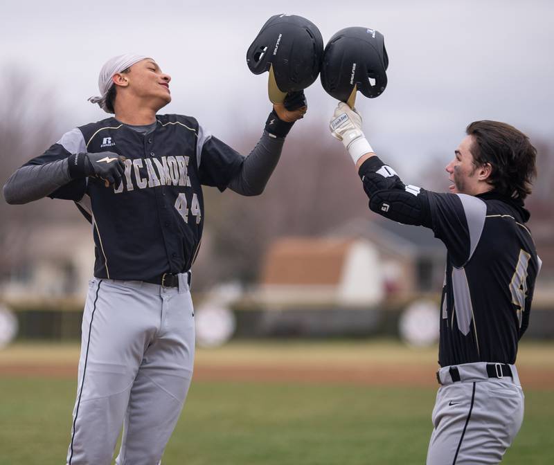 Sycamore's Tommy Townsend (44) celebrates with Hunter Britz (4) after homering in the first against Plano during a baseball game at Plano High School on Monday, April 4, 2022.