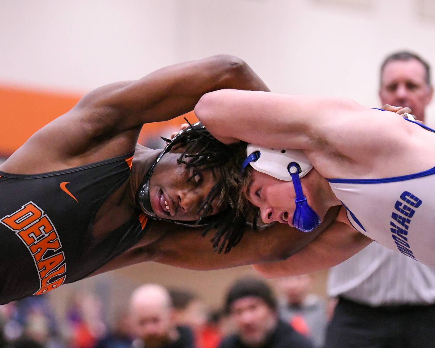 DeKalb's wrestler Midaris Chappelle, left, battles Gabe Erdmann of Mukwonago Wisconsin on Monday Dec. 29, 2025, in the 144-weight class during the Flavin Invite held at DeKalb High School.