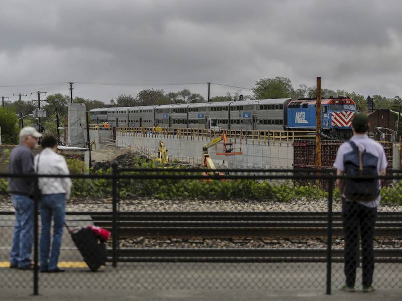 Construction of the Joliet Transportation Center continues as a Metra train moves along the Rock Island District track near Joliet's Union Station on Tuesday.