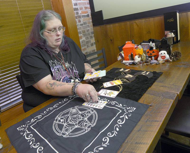 Tarot Card Reader Karen Norris begins a reading at Gaetano’s Vault during the Streator Chamber sponsored Halloween Spooktacular scavenger hunt Friday night.