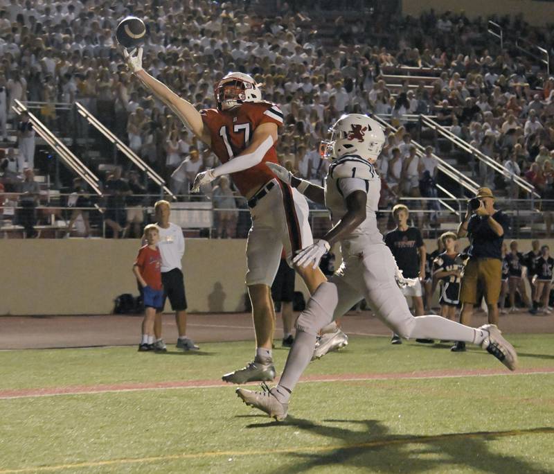Benet Academy’s Luke Wildes reaches for a pass in the endzone as Saint Viator’s Dayvion Ellis defends in a football game at Benedictine University in Lisle on Friday, Sept. 20, 2024.