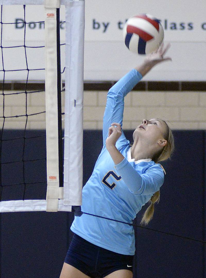 Marquette’s Anna Hjerpe works to the ball in play during first game of Monday’s night match against Reed Custer at Marquette.