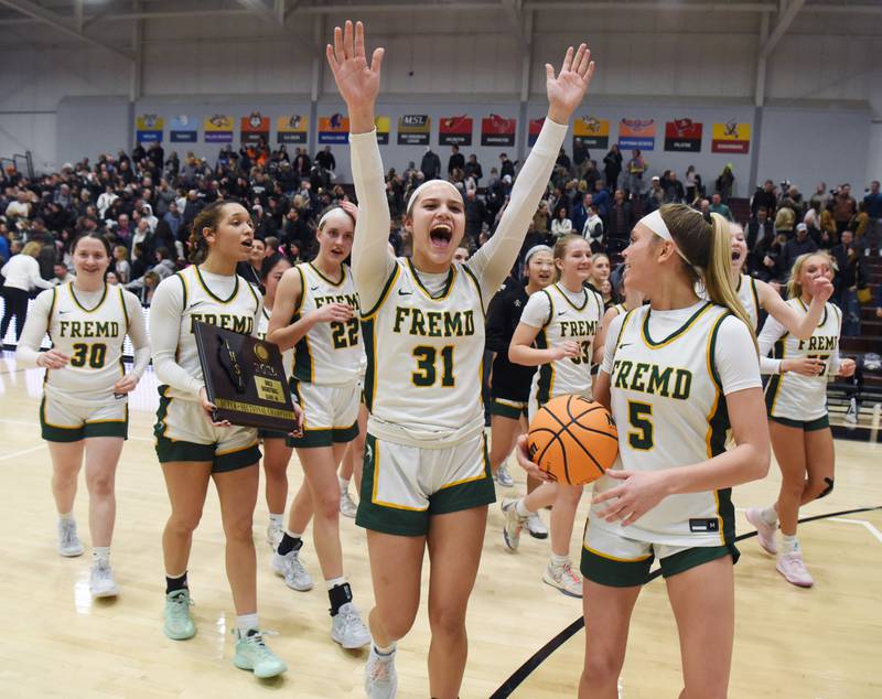 Fremd’s Bella Del Mar (31) and Ellie Thompson (5) are among Vikings players celebrating their 67-47 victory over Glenbard West during the Hersey Class 4A supersectional at Forest View Education Center on Monday, March 3, 2025 in Arlington Heights.