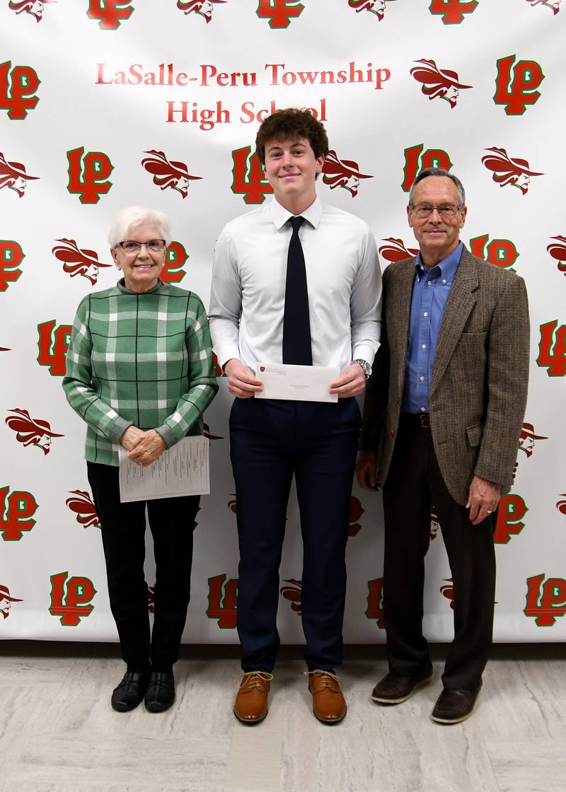 Thomas Hartman (middle) received the Ken Carey Memorial Scholarship. This $1,000 scholarship is in honor of Ken Carey, an L-P Class of 1984 graduate. It is awarded to a qualified male applicant who has been involved in sports and submits an essay on the topic of, "Describe your hunger to continue education beyond high school and why you are most deserving of this award." The scholarship was presented by Bonnie (left) and Bob Huber.